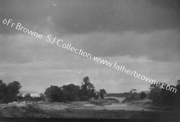 SHANNON SCHEME PARTEEN BRIDGE OVER TAIL RACE WITH RAILWAY POWER HOUSE IN DISTANCE